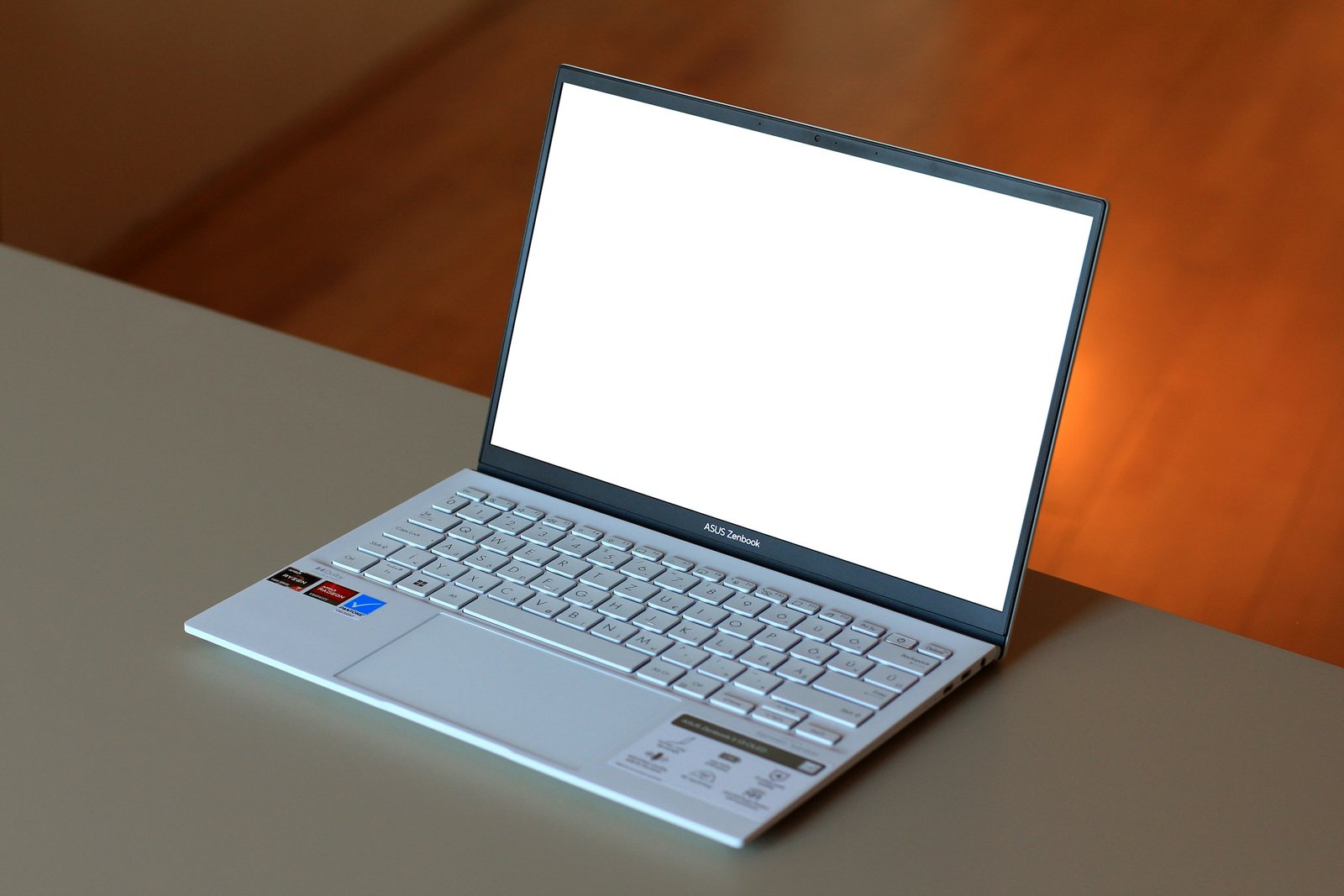 Laptop with a blank screen on a clean desk.